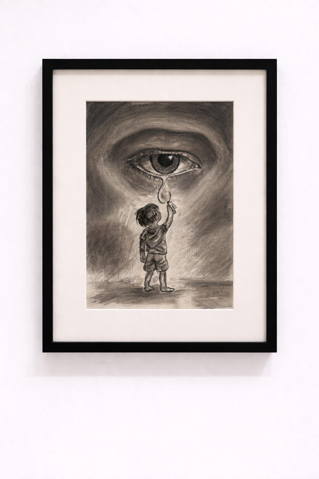 Framed artwork of a child wiping a tear from a large eye.