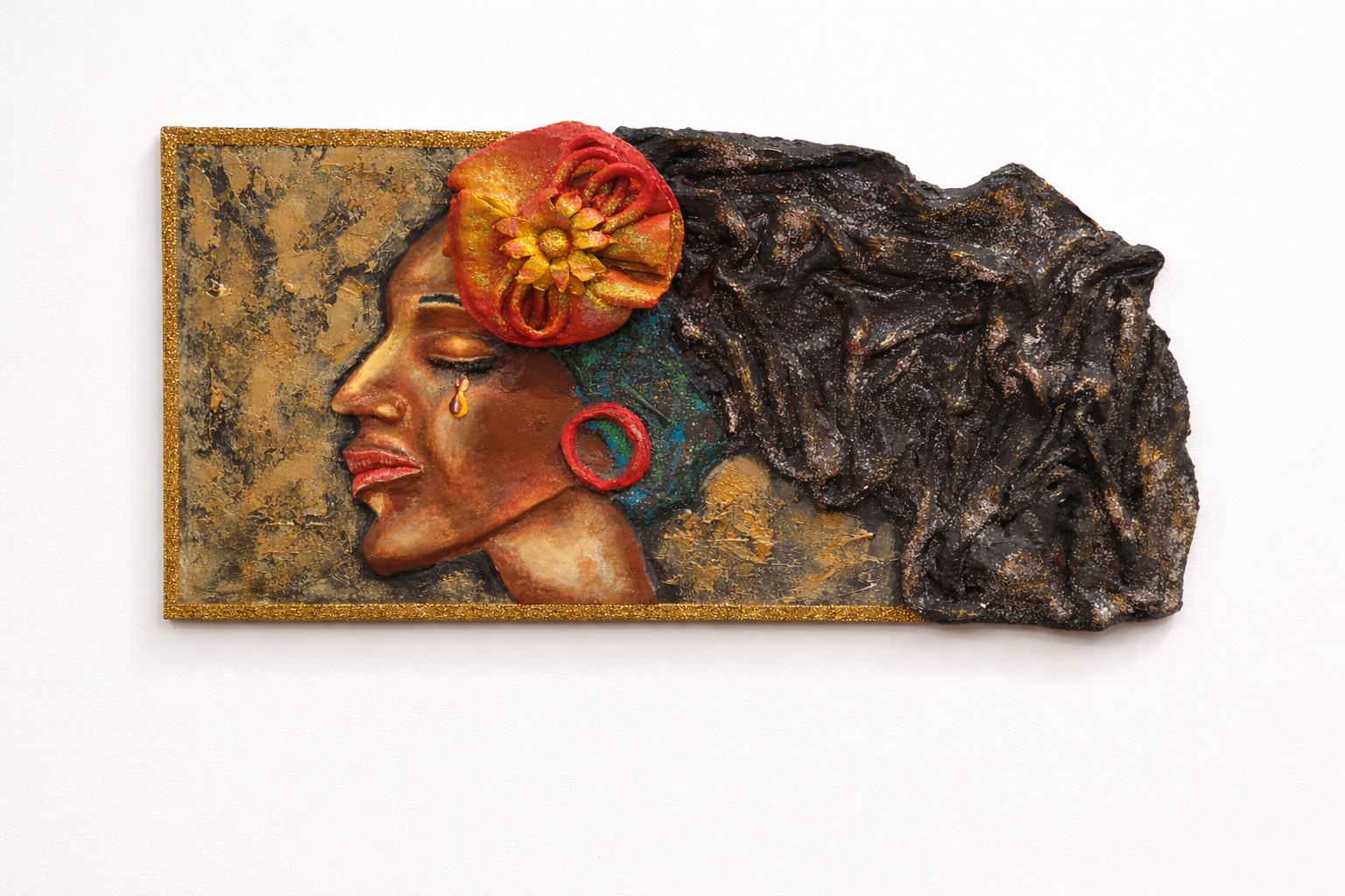 Decorative wall art of a woman's face with a flower in her hair on a textured background