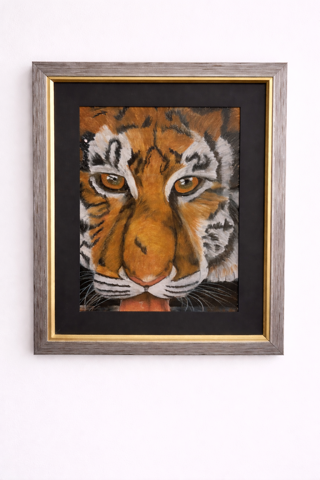Framed artwork of a tiger's face 