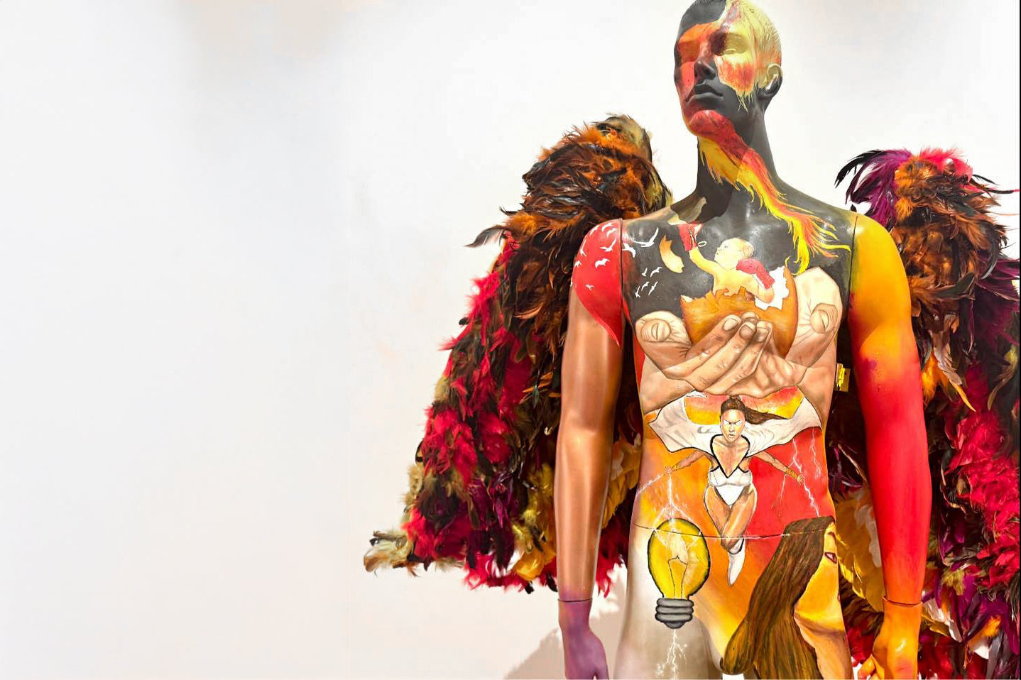 Person with colorful body art and feathers on a white background